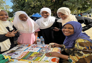 At the UN  information table, Young people in Zanzibar, receive SRHR information during the commemoration of IYD in Zanzibar. Ph
