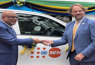 Mark Bryan Schreiner UNFPA Representative in Tanzania, handing over the key to Hon. Nassor A. Mazrui Minister of Health Zanzibar