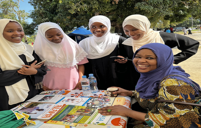 At the UN  information table, Young people in Zanzibar, receive SRHR information during the commemoration of IYD in Zanzibar. Ph