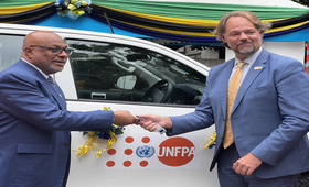 Mark Bryan Schreiner UNFPA Representative in Tanzania, handing over the key to Hon. Nassor A. Mazrui Minister of Health Zanzibar